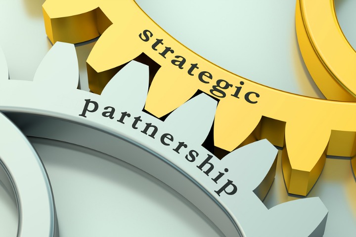 Strategic Partnership concept on the metallic gearwheels